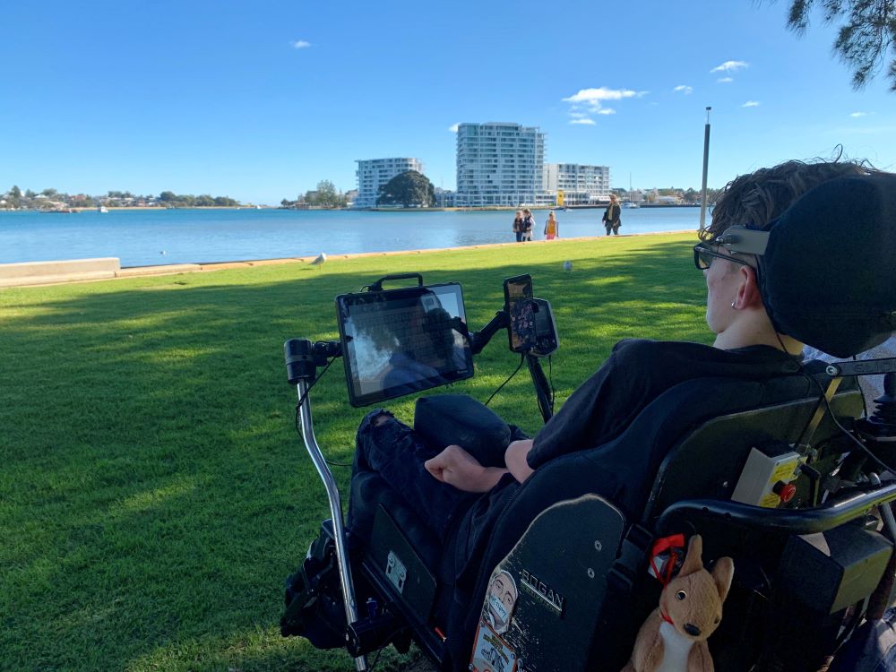 Man in wheelchair looks out over river