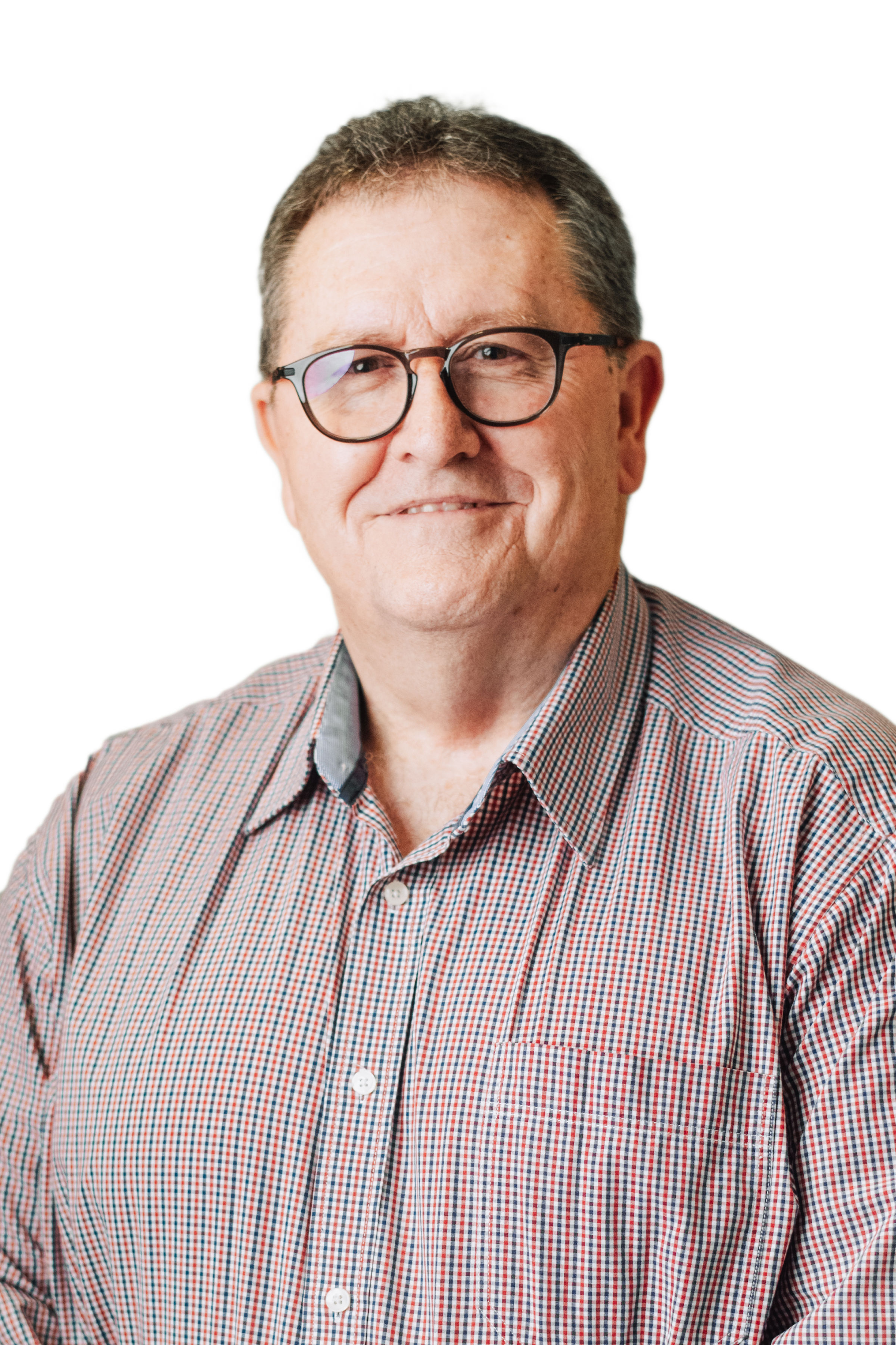 Older professional man with dark hair wearing glasses and dark blazer