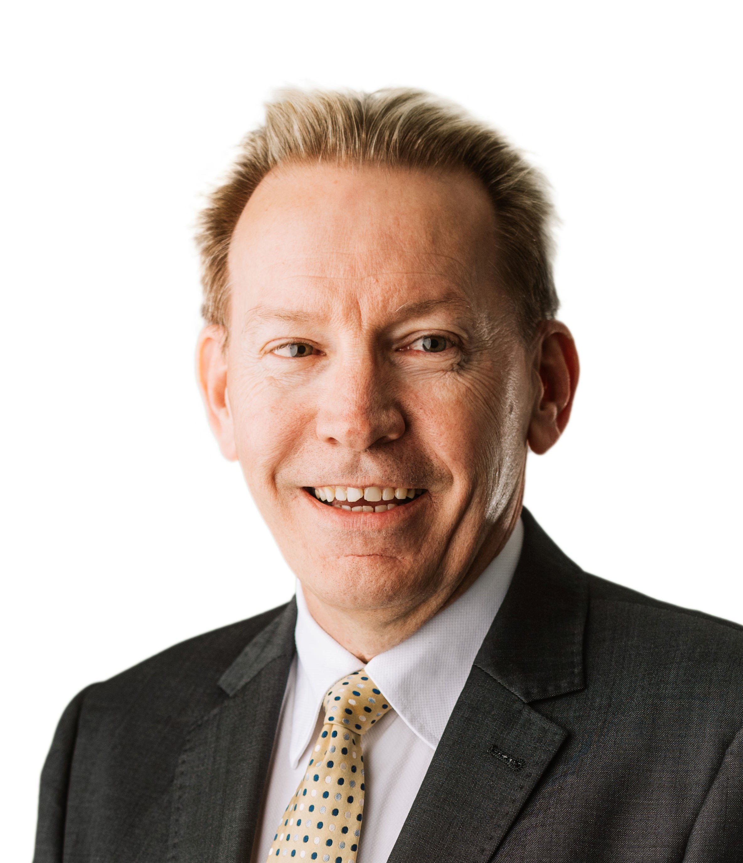 professional man, with short blond hair, wearing a suit, smiling